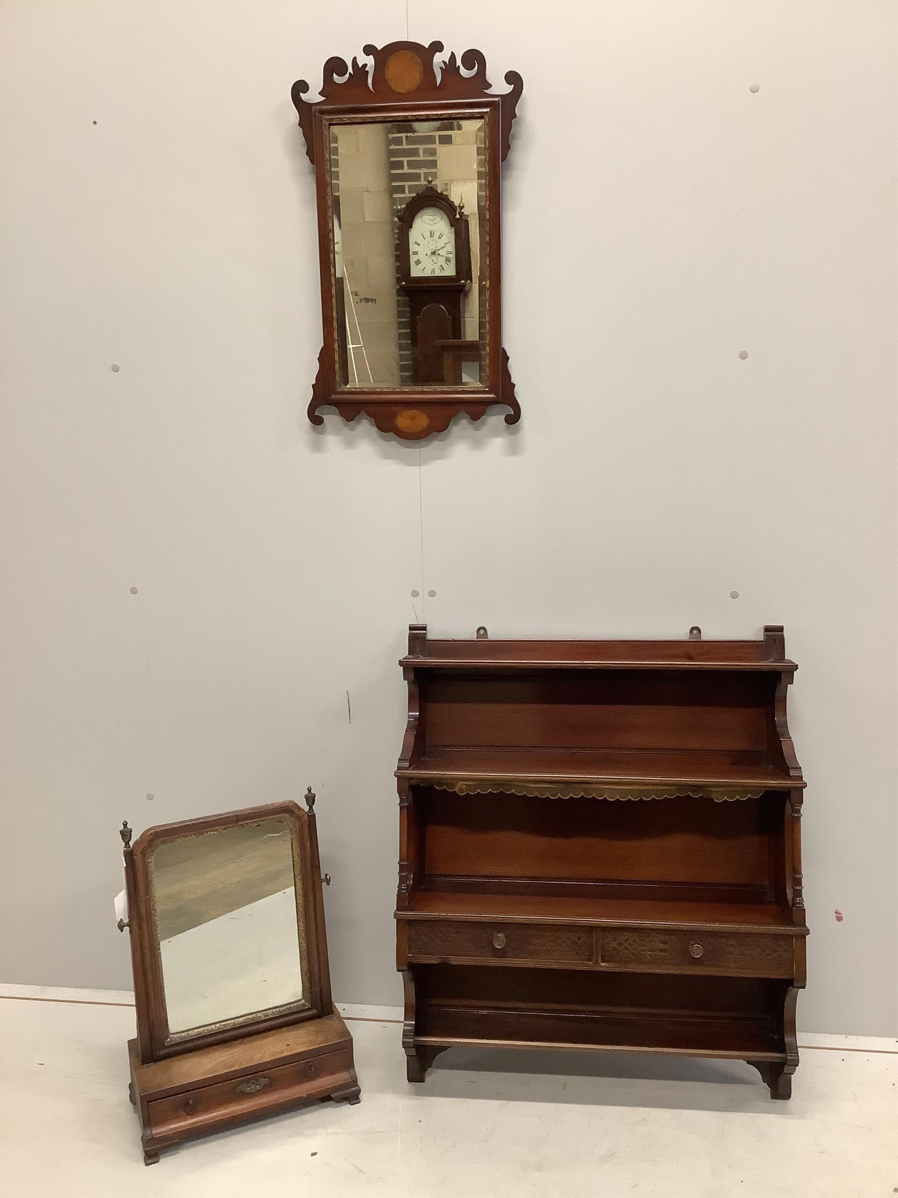 An 18th century walnut toilet mirror, height 43cm, an Edwardian inlaid fret cut wall mirror and an Edwards and Roberts mahogany wall bracket. Condition - fair to good.